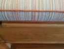 close up stripe cushion with orange piping