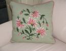 pink and green needlepoint pillow
