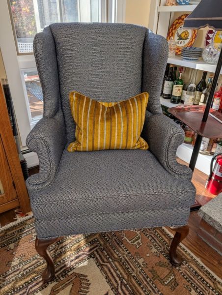 gold pillow blue chair