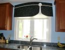black curved valance with rosette